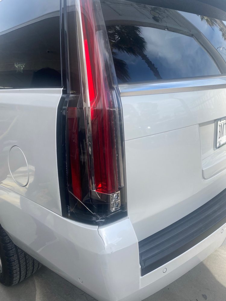 Cadillac Escalade rear tail light and quarter panel damage